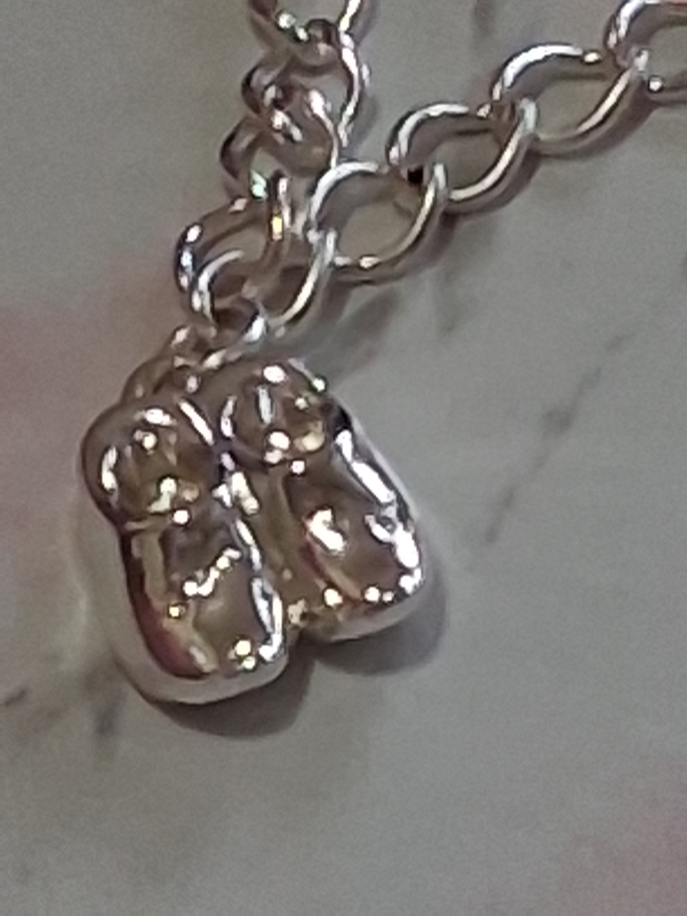 Source Unknown Silver Baby Shoes Charm on Linked Bracelet